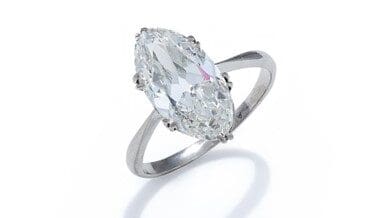 A DIAMOND SINGLE STONE RING The old marquise cut diamond, weighing 3.65 carats, in a six double claw mount, to a tapered shank, indistinctly stamped Platinum. Estimated colour I/J, estimated clarity Vs, strong fluorescence. Diamond measures approximately 14.79 x 7.97 x 4.93mm. We would look to insure this in the region of £70,000.