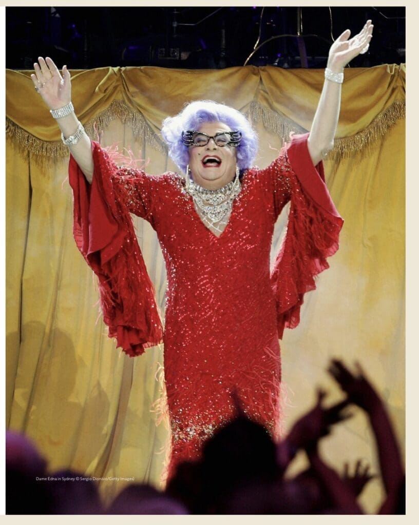 Dame Edna wearing lot 17 the ‘royal variety dress ‘ which made £21,420 vs £1500-2000 estimate