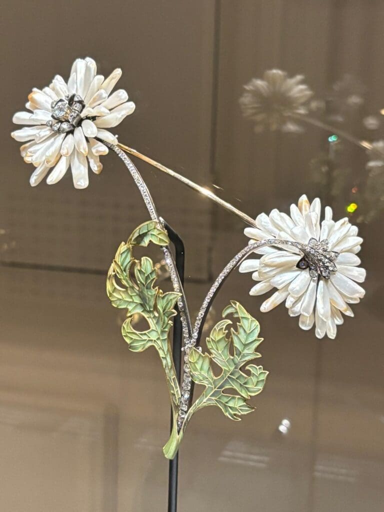 A Mississippi pearl, diamond, enamel gold and silver corsage ornament by Henri Vever, circa 1900. Faerber Collection.