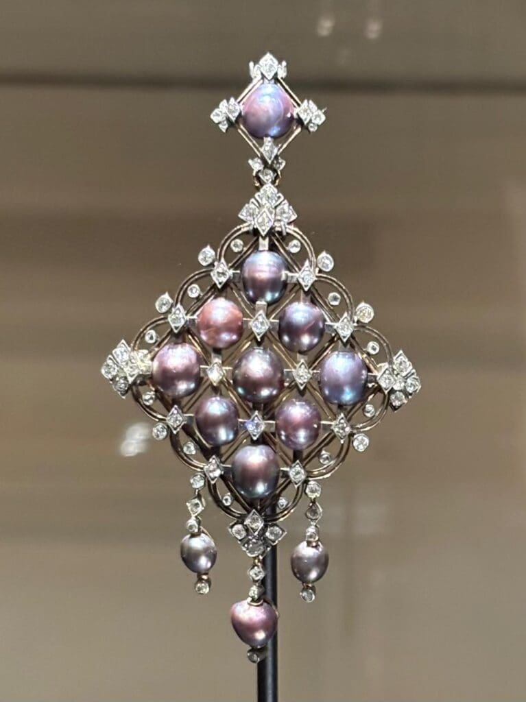 A natural grey pearl, diamond and gold pendant by Germain Bapst and Lucien Falize, circa 1880. Wartski London.