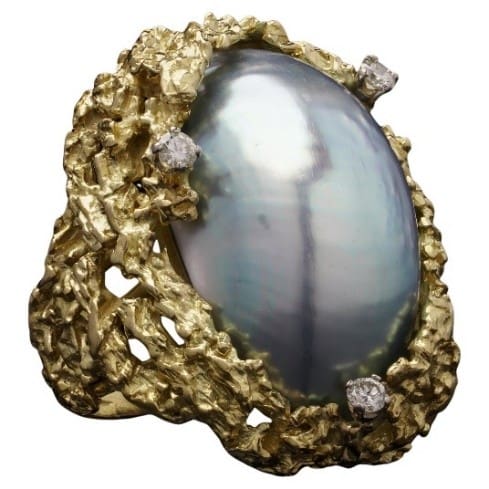 An 18ct gold blister pearl and diamond ring by Alan Gard, 1966. We would look to insure this piece with a provisional valuation of £7,000, subject to change upon physical inspection of the piece.