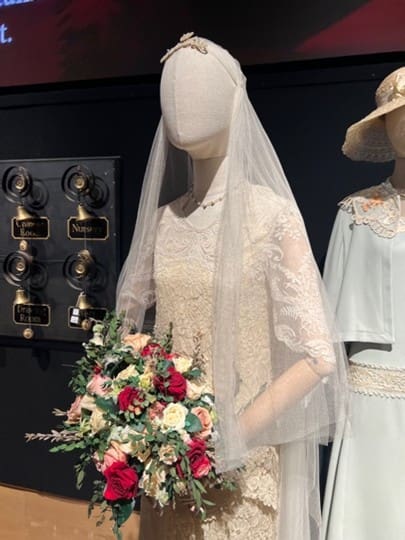 Detail of Edith Crawley’s wedding dress. The bell wall can be seen in the background. Photograph by Ashley Innes.