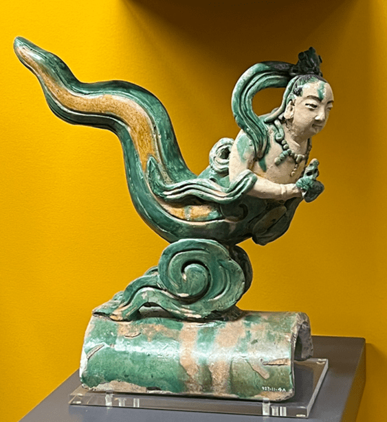 A sancai earthenware rooftile, 17th-18th century, in the shape of a mermaid at the ROM, dimensions unknown. Photograph by Ashley Innes.