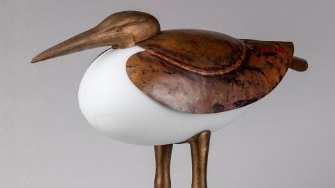 Grand Échassier lamp-sculpture, made of patinated copper and bronze for the head, wings, and legs, with a frosted opaline glass body.