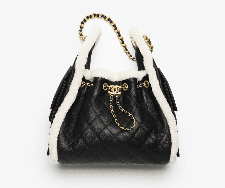 Chanel 25 Small Handbag in black crumpled shearling sheepskin and gold-tone metal.