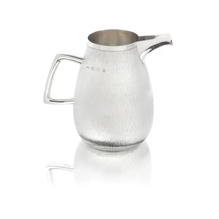 GERALD BENNEY: a silver pitcher London 1967, also stamped GERALD BENNEY, LONDON. Sold for £3,570