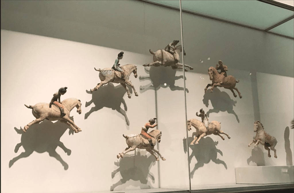A group of Tang terracotta female polo players on display at the Musée Guimet. Photograph by Ashley Innes.