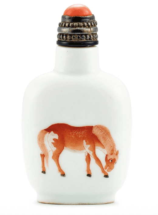 A red-and-white snuff bottle featuring a horse. Sold at Sotheby’s in 2019 for 112,500 HKD. Photograph by Sotheby’s.