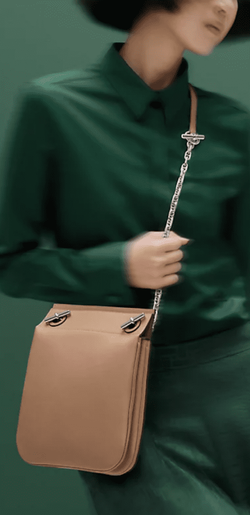 Hermes Poche Cliguets handbag available to purchase in Etoupe Swift calf skin leather with palladium hardware for £5590.